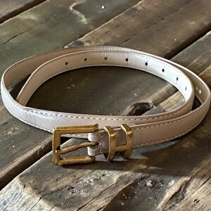 New w/o tags. Gold Buckle in a letter H. Beige Belt. 37” long.